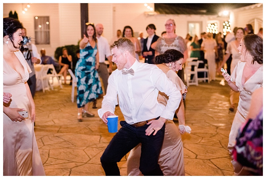 groom dancing at reception