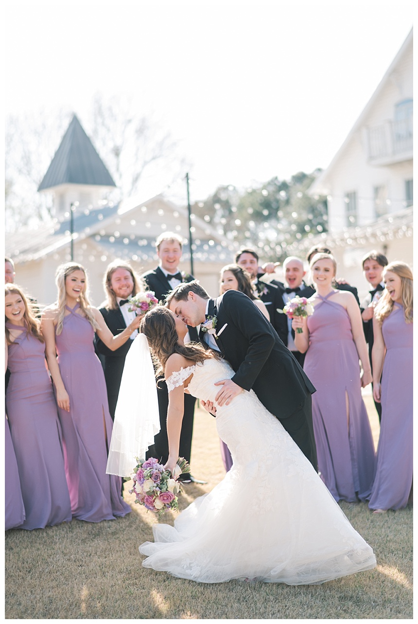 groom dipping his wife